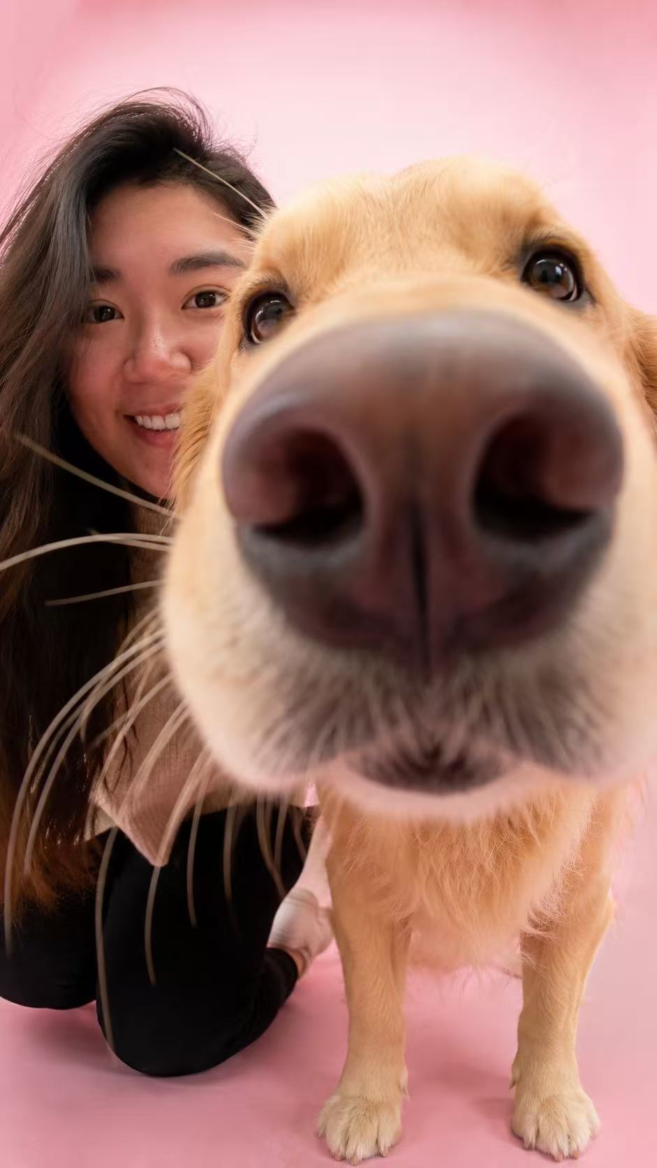 Alice, owner of Honey's Pawhouse, with her golden retriever Honey